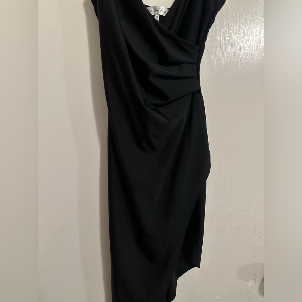 Black tight fitted formal dress half long half short ish